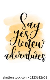 Hand drawn word. Brush pen lettering with phrase Say yes to new adventures.