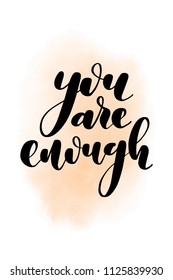 Hand drawn word. Brush pen lettering with phrase You are enough.