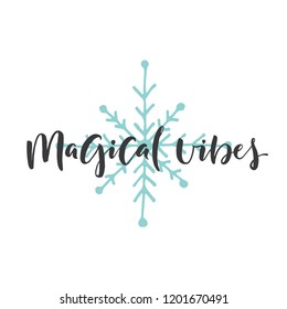 Hand drawn word and snowflake. Brush pen lettering with phrase "magical vibes"