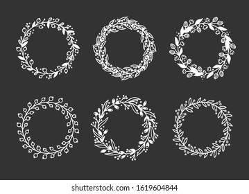 Hand drawn wreath for design use. White Vector doodle flowers on black background. Abstract pencil boho drawing branch circle. Artistic illustration elements plant and bloom