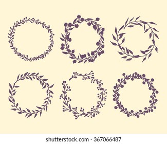 Hand drawn wreath set made in vector. Leaves, flowers and berries garland silhouettes. Romantic floral design elements.