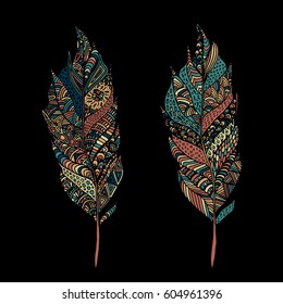 Hand drawn zentangle feather on solid background. Vintage set tribal feather. Colorful Design element.