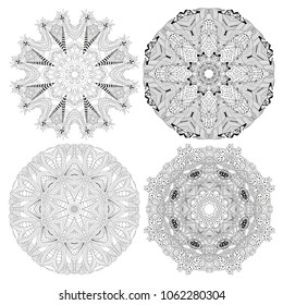 Hand drawn zentangle set of 4 mandalas for coloring page.