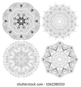 Hand drawn zentangle set of 4 mandalas for coloring page.