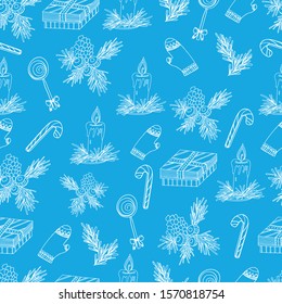 Hand draws a pattern with a cone, Christmas tree, hazelnuts, sweets, gifts with candles, white liner, contour. New Year, Christmas pattern on a blue isolate for children and adults. Design wallpaper