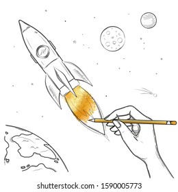 The hand draws a rocket a golden flame