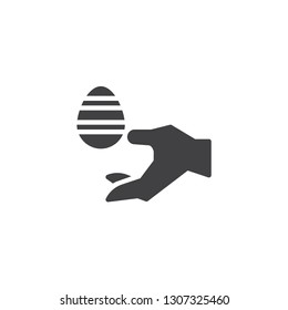 Hand with Easter egg vector icon. filled flat sign for mobile concept and web design. Hand give easter egg simple solid icon. Symbol, logo illustration. Pixel perfect vector graphics