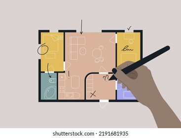 Hand editing an architectural floor plan of a two bedroom apartment with a bathroom and a dining area combined with a living room