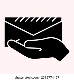 Hand with envelope glyph icon. Holding mail letter in arm. Postal service vector design concept, solid style pictogram on white background, use for web and app. Eps 10