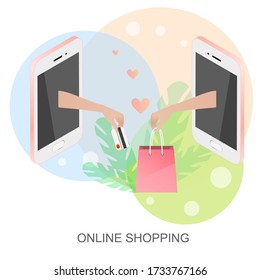 Hand feeds a purchase from the phone. The other hand submits a bank card. Online shopping concept. Safe shopping