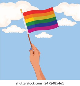 Hand of female holding a LGBTQ flag