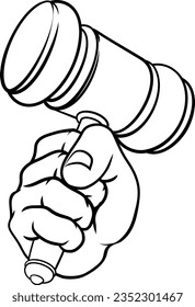 A hand in a fist holding a judge hammer gavel 