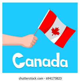 Hand with flag Canada on blue background