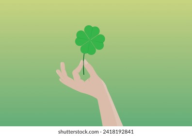 hand with four leaf clover
