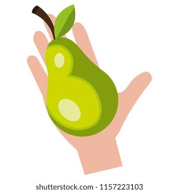 hand with fresh pear