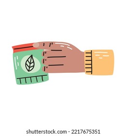 hand with gardening seeds bag
