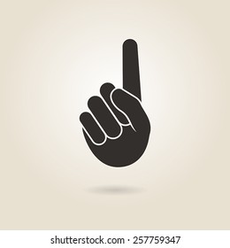 hand gesture with a raised index finger on a light background