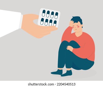 A hand gives meds and sedatives to a man to get rid of negative thoughts. Mental health and psychological problems. Addicted boy needs support because of depression. Drug addiction treatment concept.