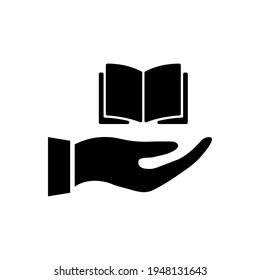 Hand giving book icon. Open book in hand. Black silhouette. Education reading concept. Vector isolated on white