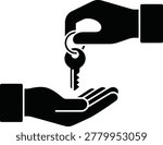 Hand giving key to another hand