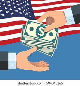 Hand giving money to other hand with USA flag background