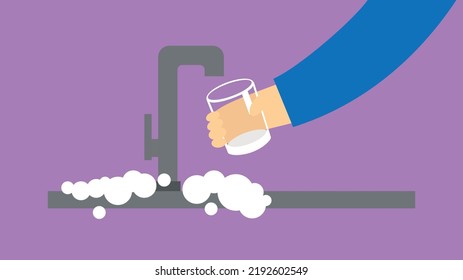 A Hand With A Glass Draws Water Under The Kitchen Faucet