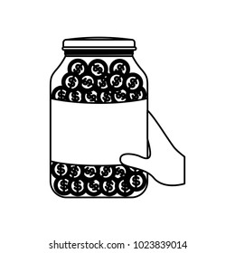 hand with glass jar and coins