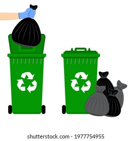 Hand in gloves holding a black bag into the garbage thrown into the green recycling bin.