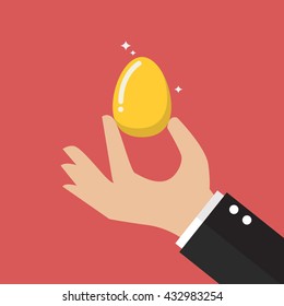 Hand with golden egg. flat style design