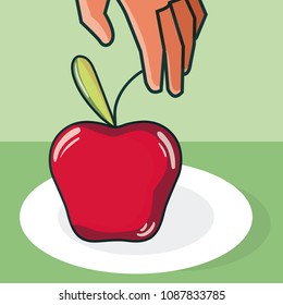 Hand grabbing apple