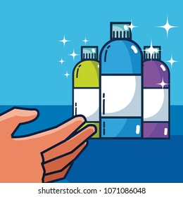 Hand grabbing detergent bottles
