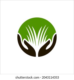 hand and grass as lawn care or nature logo