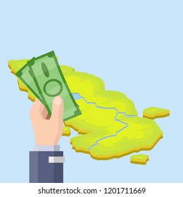 Hand with green cash and a tropical island for leisure travelers. Buying a ticket to another southern country with the sea.
