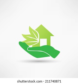 Hand and green house