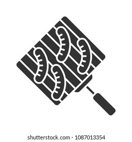 Hand grill with sausages glyph icon. Barbecue grid. Silhouette symbol. Negative space. Vector isolated illustration