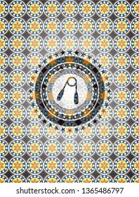 hand gripper icon inside arabesque style badge. arabic decoration.