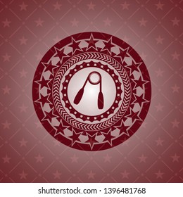 hand gripper icon inside badge with red background