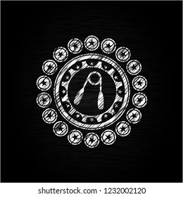 hand gripper icon inside chalk emblem written on a blackboard