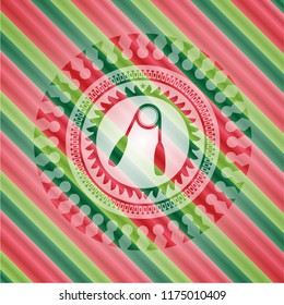 hand gripper icon inside christmas colors style badge.