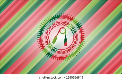 hand gripper icon inside christmas colors style emblem.