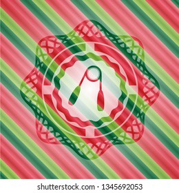 hand gripper icon inside christmas colors emblem.