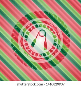 hand gripper icon inside christmas colors style badge.