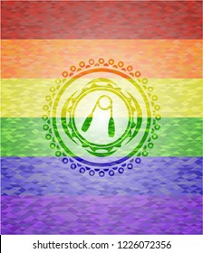 hand gripper icon inside emblem on mosaic background with the colors of the LGBT flag