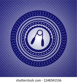 hand gripper icon inside emblem with denim texture