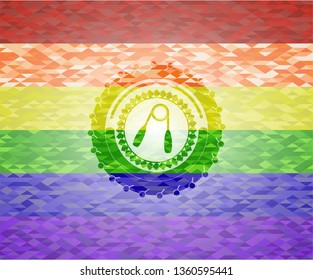 hand gripper icon inside emblem on mosaic background with the colors of the LGBT flag