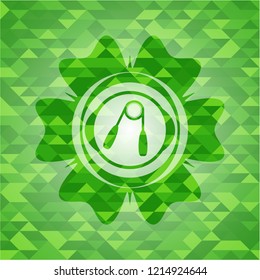 hand gripper icon inside green emblem with triangle mosaic background