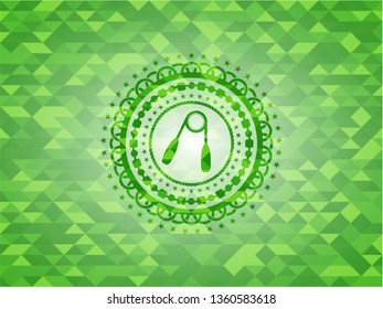 hand gripper icon inside green emblem with mosaic ecological style background