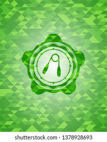 hand gripper icon inside green mosaic emblem