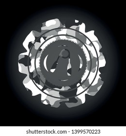 hand gripper icon inside grey camo emblem
