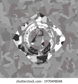 hand gripper icon inside grey camo texture. 